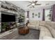 Open living room featuring a custom stone wall, contemporary decor, and comfortable seating area at 1912 S Colt Dr, Gilbert, AZ 85295