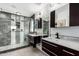 Luxurious bathroom featuring double sinks, modern fixtures, and walk-in shower at 1912 S Colt Dr, Gilbert, AZ 85295