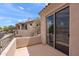 Balcony featuring views of nearby townhouses and desert vegetation under a bright sky at 19475 N Grayhawk Dr # 2151, Scottsdale, AZ 85255