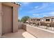 Balcony with views of the community, including townhouses, trees, and landscaping at 19475 N Grayhawk Dr # 2151, Scottsdale, AZ 85255