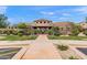 Community clubhouse with well-manicured landscaping and desert plants at 19475 N Grayhawk Dr # 2151, Scottsdale, AZ 85255
