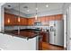 Modern kitchen with dark countertops, stainless steel appliances, and pendant lighting, perfect for cooking at 19475 N Grayhawk Dr # 2151, Scottsdale, AZ 85255
