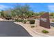 Community sign for Tesoro at Grayhawk with desert landscaping and a paved entrance road at 19475 N Grayhawk Dr # 2151, Scottsdale, AZ 85255