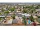 Scenic aerial view of the property with its surrounding neighborhood and distant mountain backdrop at 2122 W Virginia Ave, Phoenix, AZ 85009