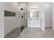 Elegant bathroom featuring a walk-in shower, dual sinks, and modern lighting fixtures at 2122 W Virginia Ave, Phoenix, AZ 85009