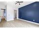 Bedroom featuring a painted accent wall and wood flooring at 2122 W Virginia Ave, Phoenix, AZ 85009