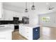 Spacious modern kitchen featuring stainless appliances, stylish pendant lighting, and ample cabinetry at 2122 W Virginia Ave, Phoenix, AZ 85009