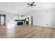 Open-concept living space featuring new floors and a modern kitchen with a large peninsula at 2122 W Virginia Ave, Phoenix, AZ 85009