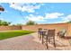 Picture perfect backyard features an expansive brick paver area and new artificial turf at 21667 S 225Th Way, Queen Creek, AZ 85142