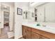 Bathroom featuring a vanity with white countertops and ample storage with wood-style flooring at 21667 S 225Th Way, Queen Creek, AZ 85142