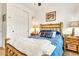Comfortable bedroom with wooden bed frame and side tables, creating a rustic feel at 21667 S 225Th Way, Queen Creek, AZ 85142