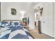Bright bedroom with blue bedding, a playful Minecraft poster, and an ensuite bathroom at 21667 S 225Th Way, Queen Creek, AZ 85142