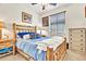 Comfortable bedroom with wooden bed frame and side tables, creating a rustic feel at 21667 S 225Th Way, Queen Creek, AZ 85142
