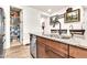 Modern kitchen island with granite countertops, stainless steel appliances, and a walk-in pantry at 21667 S 225Th Way, Queen Creek, AZ 85142