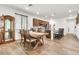 Open-concept kitchen with stainless steel appliances, granite countertops, island, and a casual dining area at 21667 S 225Th Way, Queen Creek, AZ 85142