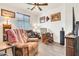 Comfortable living room showcases two chairs, tile floor, and homey decor at 21667 S 225Th Way, Queen Creek, AZ 85142