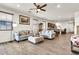 Large open-concept living room and dining area featuring wood-style flooring and comfortable seating at 21667 S 225Th Way, Queen Creek, AZ 85142