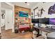 A well-lit office space with wood-paneled accent wall and dual monitor setup at 21667 S 225Th Way, Queen Creek, AZ 85142
