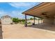 A spacious backyard featuring a covered patio, a storage shed, and a well-maintained lawn at 2210 W Tonto Ln, Phoenix, AZ 85027