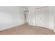 Spacious bedroom with closet space, carpet flooring, and neutral wall color scheme at 2210 W Tonto Ln, Phoenix, AZ 85027