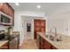 Well-appointed kitchen with granite counters, stainless appliances, and dark wood cabinets at 2210 W Tonto Ln, Phoenix, AZ 85027