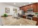 Kitchen featuring granite counters, stainless steel appliances and custom cabinetry at 2210 W Tonto Ln, Phoenix, AZ 85027