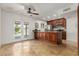 A spacious kitchen area with island, tile floors, stainless appliances and an outdoor view at 2210 W Tonto Ln, Phoenix, AZ 85027