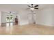 Bright open-concept living room featuring tile flooring and views into the updated kitchen at 2210 W Tonto Ln, Phoenix, AZ 85027
