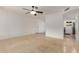 Open-concept living room featuring neutral walls, tile flooring and a modern ceiling fan at 2210 W Tonto Ln, Phoenix, AZ 85027