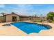 Sparkling swimming pool surrounded by a concrete deck and secure fencing in a private backyard setting at 2210 W Tonto Ln, Phoenix, AZ 85027