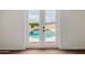 A view of the pool area as seen through a set of patio doors at 2210 W Tonto Ln, Phoenix, AZ 85027