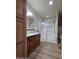 Bathroom showcasing a double vanity, mirror, and a glass-enclosed shower at 2233 E Behrend Dr # 203, Phoenix, AZ 85024