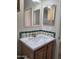 Bathroom featuring a single vanity sink with colorful tile and natural light at 2233 E Behrend Dr # 203, Phoenix, AZ 85024