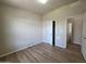 This bedroom features wood-look flooring, bright windows and an open closet at 2233 E Behrend Dr # 203, Phoenix, AZ 85024