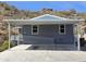 Charming single-level home featuring desert landscaping and covered parking space with disability access at 2233 E Behrend Dr # 203, Phoenix, AZ 85024