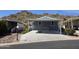 Charming single-level home featuring desert landscaping and covered parking space with disability access at 2233 E Behrend Dr # 203, Phoenix, AZ 85024