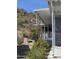 Home exterior featuring desert landscaping with vibrant bougainvillea and yellow flowering bushes at 2233 E Behrend Dr # 203, Phoenix, AZ 85024