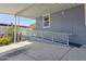 Inviting home exterior featuring a wheelchair ramp, covered parking and colorful flowers at 2233 E Behrend Dr # 203, Phoenix, AZ 85024