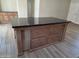 Kitchen island with drawers providing extra workspace and storage in the kitchen at 2233 E Behrend Dr # 203, Phoenix, AZ 85024
