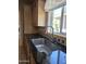 Modern kitchen sink area with a window view and designer tile backsplash at 2233 E Behrend Dr # 203, Phoenix, AZ 85024