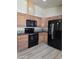 Close-up of the kitchen with stainless steel appliances and a spacious layout at 2233 E Behrend Dr # 203, Phoenix, AZ 85024