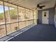 Bright and airy screened-in porch with a ceiling fan overlooking the desert landscape at 2233 E Behrend Dr # 203, Phoenix, AZ 85024