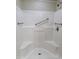 Accessible walk-in shower with grab bars and dual built-in seating for convenience at 2233 E Behrend Dr # 203, Phoenix, AZ 85024