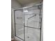 Updated shower with glass doors, built-in seating, and convenient grab bars at 2233 E Behrend Dr # 203, Phoenix, AZ 85024