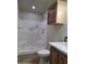 Bathroom with accessible shower featuring safety bars and built in corner seating at 2233 E Behrend Dr # 203, Phoenix, AZ 85024