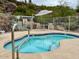 Community spa pool with a No Diving sign and outdoor seating area at 2233 E Behrend Dr # 203, Phoenix, AZ 85024