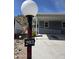 Home exterior with mountain views in the background and address number visible on the light post at 2233 E Behrend Dr # 203, Phoenix, AZ 85024