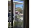The sliding glass door leads to a patio, showcasing mountain views and a glimpse of the surrounding neighborhood at 2233 E Behrend Dr # 203, Phoenix, AZ 85024