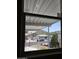 This window offers a bright view of a charming streetscape at 2233 E Behrend Dr # 203, Phoenix, AZ 85024
