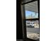 This window view shows the mountain backdrop and sunny neighborhood at 2233 E Behrend Dr # 203, Phoenix, AZ 85024